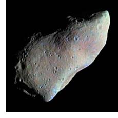 The image is a false color view of the asteroid 951 Gaspra taken by the Galileo spacecraft.