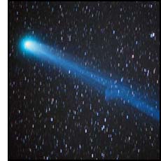 A picture of the comet Hyakutake, passing across the handle of the Big Dipper on March 25, 1996.